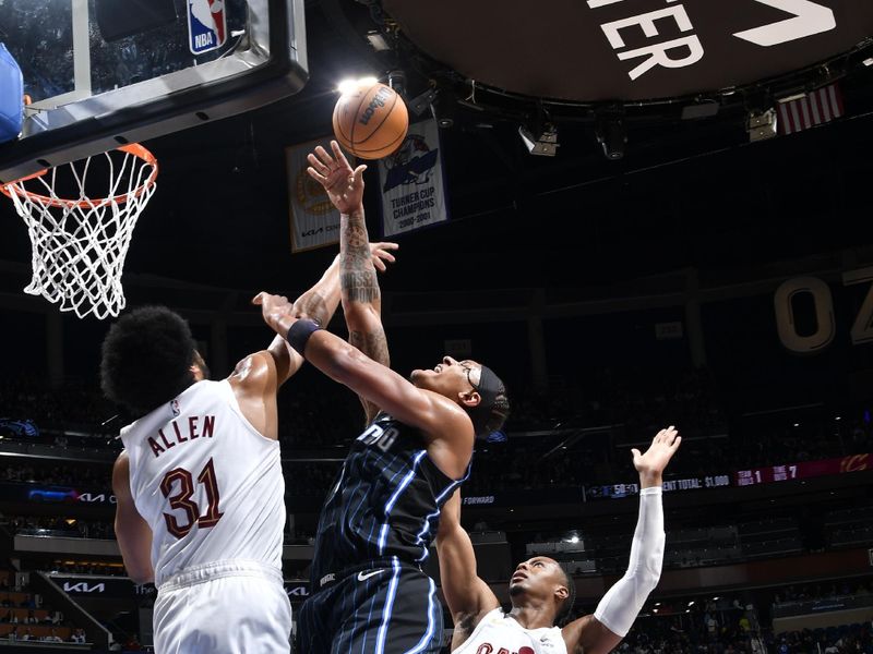 ORLANDO, FL - JANUARY 22: Paolo Banchero #5 of the Orlando Magic and Jarrett Allen #31 of the Cleveland Cavaliers battle for a rebound on January 22, 2024 at Kia Center in Orlando, Florida. NOTE TO USER: User expressly acknowledges and agrees that, by downloading and or using this photograph, User is consenting to the terms and conditions of the Getty Images License Agreement. Mandatory Copyright Notice: Copyright 2024 NBAE (Photo by Fernando Medina/NBAE via Getty Images)