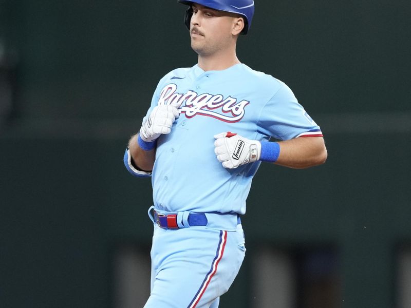 Aug 20, 2023; Arlington, Texas, USA; Texas Rangers first baseman Nathaniel Lowe (30) runs to second base on his double against the Milwaukee Brewers during the third inning at Globe Life Field. Mandatory Credit: Jim Cowsert-USA TODAY Sports