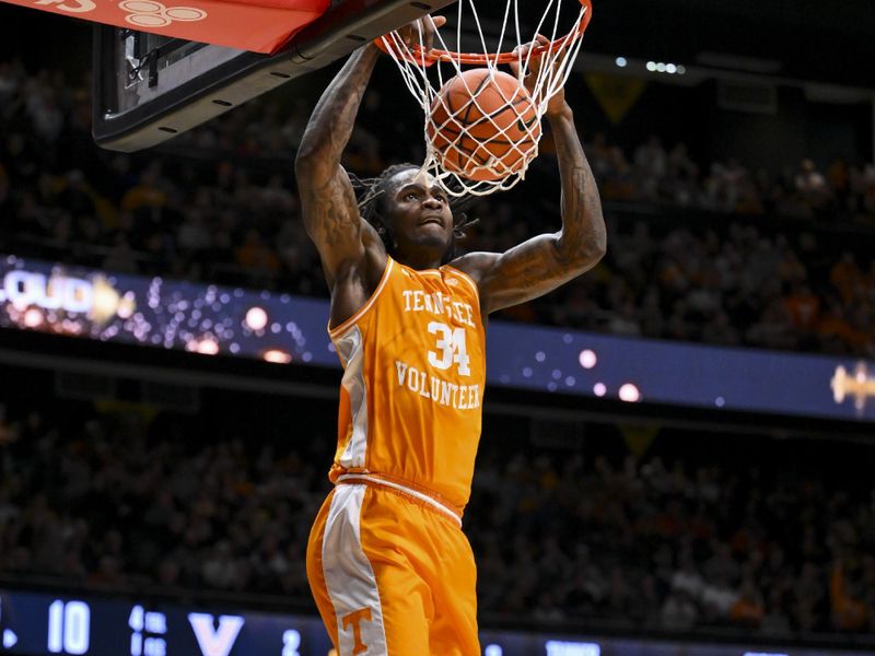Feb 21, 2026; Nashville, Tennessee, USA;  Tennessee Volunteers center Felix Okpara (34) dunks the ball against the Vanderbilt Commodores during the first half at Memorial Gymnasium. Mandatory Credit: Steve Roberts-Imagn Images