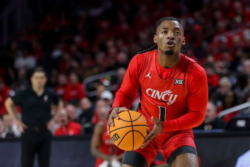 Mar 9, 2024; Cincinnati, Ohio, USA; Cincinnati Bearcats guard Day Day Thomas (1) holds the ball against the West Virginia Mountaineers in the first half at Fifth Third Arena. Mandatory Credit: Katie Stratman-USA TODAY Sports