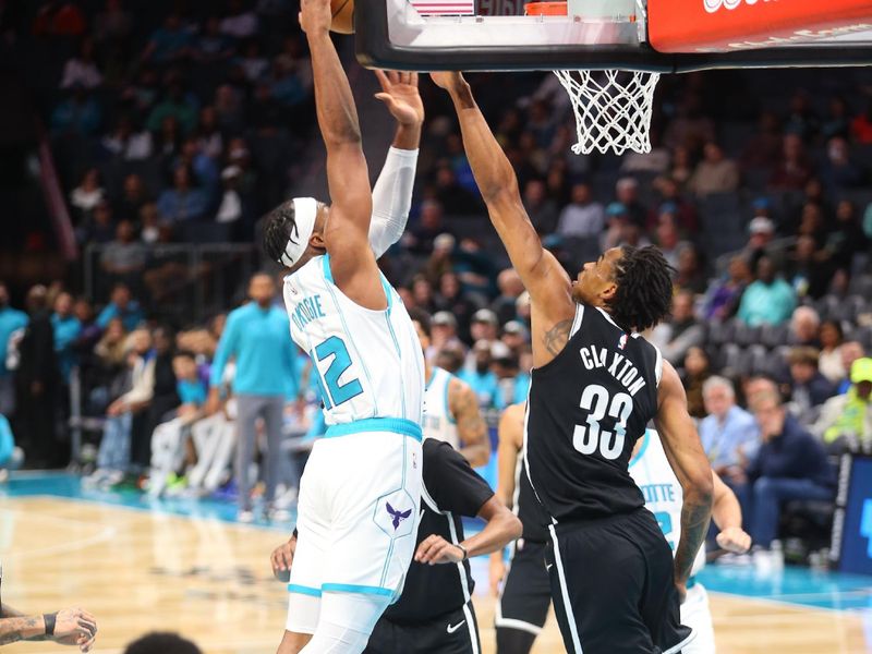 CHARLOTTE, NC - JANUARY 29:  Josh Okogie #12 of the Charlotte Hornets dunks the ball during the game against the Brooklyn Nets on January 29, 2025 at Spectrum Center in Charlotte, North Carolina. NOTE TO USER: User expressly acknowledges and agrees that, by downloading and or using this photograph, User is consenting to the terms and conditions of the Getty Images License Agreement. Mandatory Copyright Notice: Copyright 2025 NBAE (Photo by Kent Smith/NBAE via Getty Images)