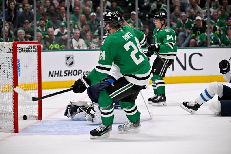 May 13, 2025; Dallas, Texas, USA; Dallas Stars center Mikael Granlund (64) scores a goal against the Winnipeg Jets as center Roope Hintz (24) looks on during the second period in game four of the second round of the 2025 Stanley Cup Playoffs at American Airlines Center. Mandatory Credit: Jerome Miron-Imagn Images