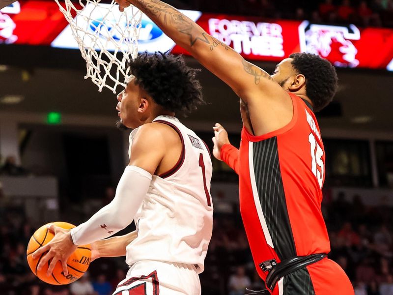 Mar 4, 2023; Columbia, South Carolina, USA; South Carolina Gamecocks guard Jacobi Wright (1) drives past Georgia Bulldogs forward Jailyn Ingram (15) in the first half at Colonial Life Arena. Mandatory Credit: Jeff Blake-USA TODAY Sports