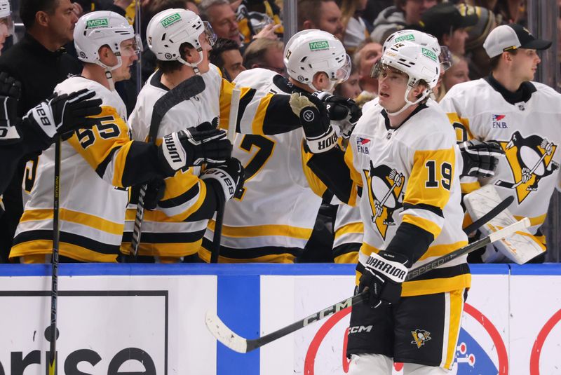 Jan 17, 2025; Buffalo, New York, USA;  Pittsburgh Penguins center Cody Glass (19) celebrates his goal with teammates during the second period against the Buffalo Sabres at KeyBank Center. Mandatory Credit: Timothy T. Ludwig-Imagn Images