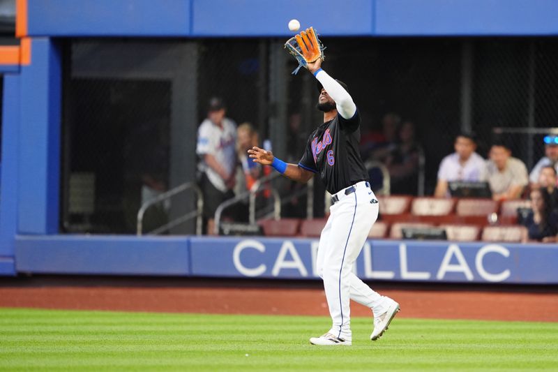 May 31, 2024; New York City, New York, USA; New York Mets right fielder Starling Marte (6) catches a fly ball hit by Arizona Diamondbacks third baseman Eugenio Suarez (not pictured) during the first inning at Citi Field. Mandatory Credit: Gregory Fisher-USA TODAY Sports