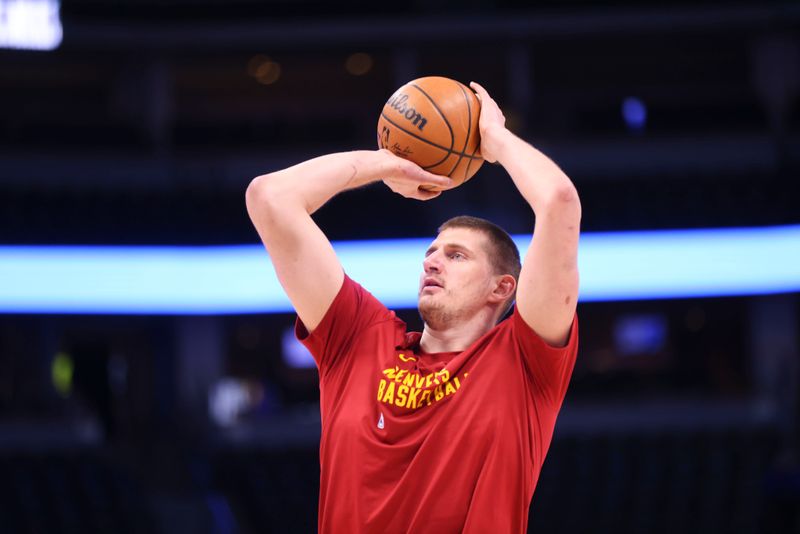 DENVER, COLORADO - FEBRUARY 28: Nikola Jokic #15 of the Denver Nuggets shoots the ball during warm-up before the game against the Sacramento Kings at Ball Arena on February 28, 2024 in Denver, Colorado. NOTE TO USER: User expressly acknowledges and agrees that, by downloading and or using this photograph, User is consenting to the terms and conditions of the Getty Images License Agreement. (Photo by Alysa Rubin/Clarkson Creative/Getty Images)