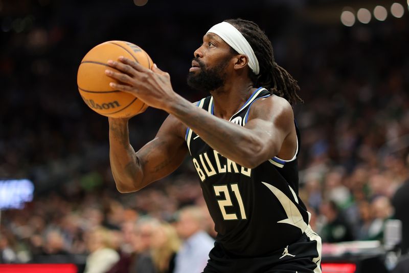 MILWAUKEE, WISCONSIN - APRIL 09: Patrick Beverley #21 of the Milwaukee Bucks takes a three point shot during a game against the Boston Celtics at Fiserv Forum on April 09, 2024 in Milwaukee, Wisconsin. NOTE TO USER: User expressly acknowledges and agrees that, by downloading and or using this photograph, User is consenting to the terms and conditions of the Getty Images License Agreement. (Photo by Stacy Revere/Getty Images)