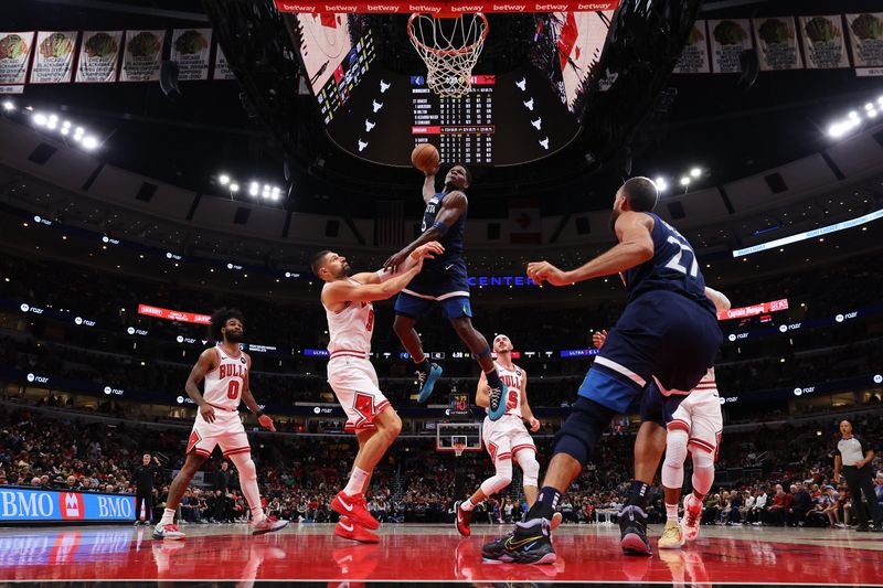 CHICAGO, ILLINOIS - OCTOBER 19: Anthony Edwards #5 of the Minnesota Timberwolves dunks against the Chicago Bulls during the first half of a preseason game at the United Center on October 19, 2023 in Chicago, Illinois. NOTE TO USER: User expressly acknowledges and agrees that, by downloading and or using this photograph, User is consenting to the terms and conditions of the Getty Images License Agreement.  (Photo by Michael Reaves/Getty Images)