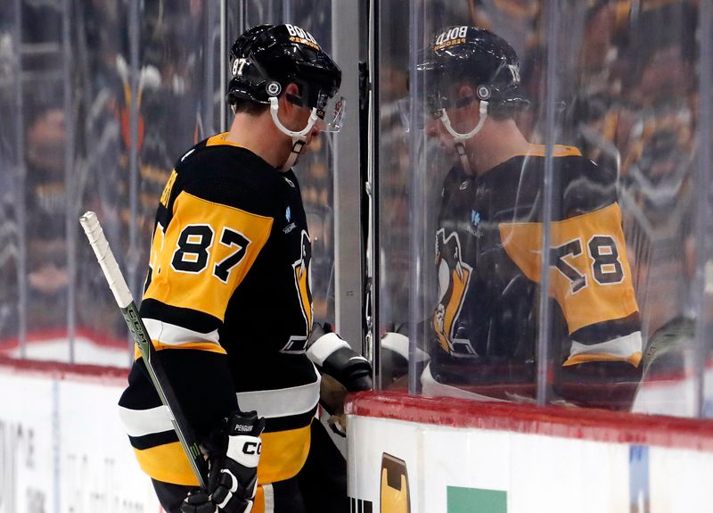 Feb 25, 2024; Pittsburgh, Pennsylvania, USA;  Pittsburgh Penguins center Sidney Crosby (87) steps into the penalty box on a tripping penalty against the Philadelphia Flyers during the third period at PPG Paints Arena. Pittsburgh won 7-6. Mandatory Credit: Charles LeClaire-USA TODAY Sports