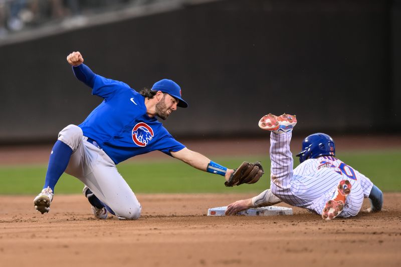 Aug 9, 2023; New York City, New York, USA; New York Mets first baseman Pete Alonso (20) steals second base as Chicago Cubs shortstop Dansby Swanson (7) fields the throw during the second inning at Citi Field. Mandatory Credit: John Jones-USA TODAY Sports