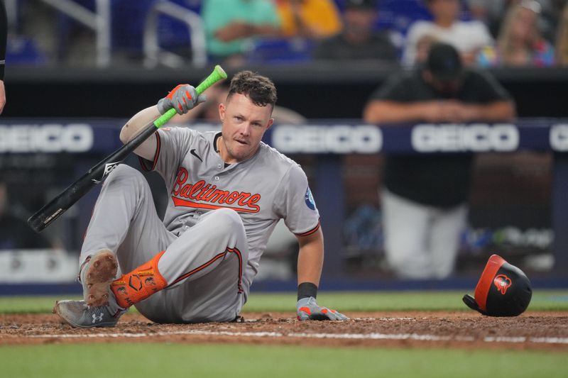 Jul 25, 2024; Miami, Florida, USA;  Baltimore Orioles first baseman Ryan Mountcastle (6) reacts after being knocked down by a pitch in the fifth inning against the Miami Marlins at loanDepot Park. Mandatory Credit: Jim Rassol-USA TODAY Sports