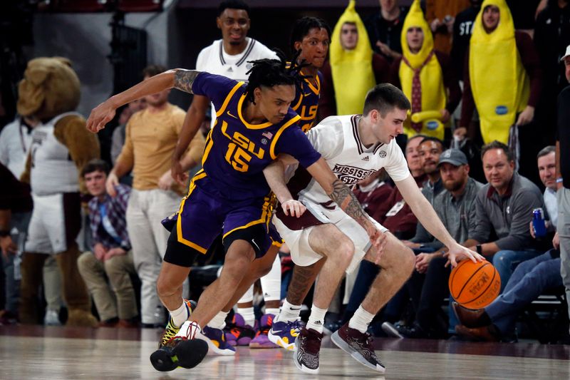 Feb 8, 2023; Starkville, Mississippi, USA; Mississippi State Bulldogs guard Isaac Stansbury (25) dribbles as LSU Tigers forward Tyrell Ward (15) defends during the second half at Humphrey Coliseum. Mandatory Credit: Petre Thomas-USA TODAY Sports