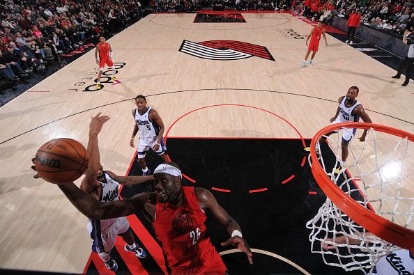 PORTLAND, OR - DECEMBER 26: Duop Reath #26 of the Portland Trail Blazers drives to the basket during the game against the Sacramento Kings on December 26, 2023 at the Moda Center Arena in Portland, Oregon. NOTE TO USER: User expressly acknowledges and agrees that, by downloading and or using this photograph, user is consenting to the terms and conditions of the Getty Images License Agreement. Mandatory Copyright Notice: Copyright 2023 NBAE (Photo by Cameron Browne/NBAE via Getty Images)
