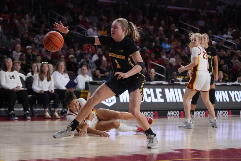 Dec 29, 2024; Los Angeles, California, USA; Michigan Wolverines guard Olivia Olson (1) reaches for the ball against the Southern California Trojans in the first half at Galen Center. Mandatory Credit: Kirby Lee-Imagn Images