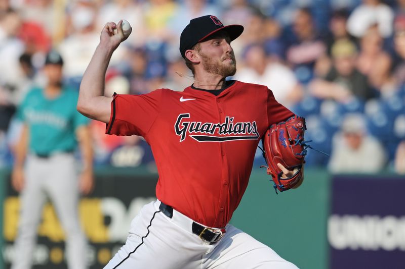 Jun 19, 2024; Cleveland, Ohio, USA; Cleveland Guardians starting pitcher Tanner Bibee (28) throws a pitch during the first inning against the Seattle Mariners at Progressive Field. Mandatory Credit: Ken Blaze-USA TODAY Sports