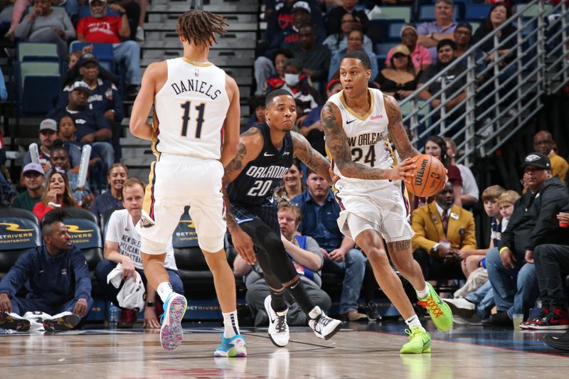 NEW ORLEANS, LA - OCTOBER 10: Jordan Hawkins #24 of the New Orleans Pelicans handles the ball during the game against the Orlando Magic on October 10, 2023 at the Smoothie King Center in New Orleans, Louisiana. NOTE TO USER: User expressly acknowledges and agrees that, by downloading and or using this Photograph, user is consenting to the terms and conditions of the Getty Images License Agreement. Mandatory Copyright Notice: Copyright 2023 NBAE (Photo by Layne Murdoch Jr./NBAE via Getty Images)