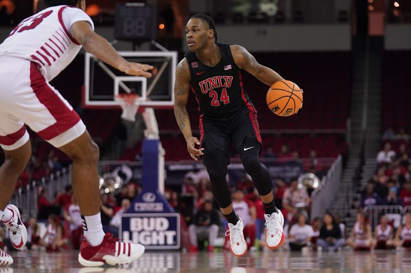 Feb 14, 2024; Fresno, California, USA; UNLV Rebels guard Jackie Johnson III (24) dribbles the ball against the Fresno State Bulldogs in the first half at the Save Mart Center. Mandatory Credit: Cary Edmondson-USA TODAY Sports