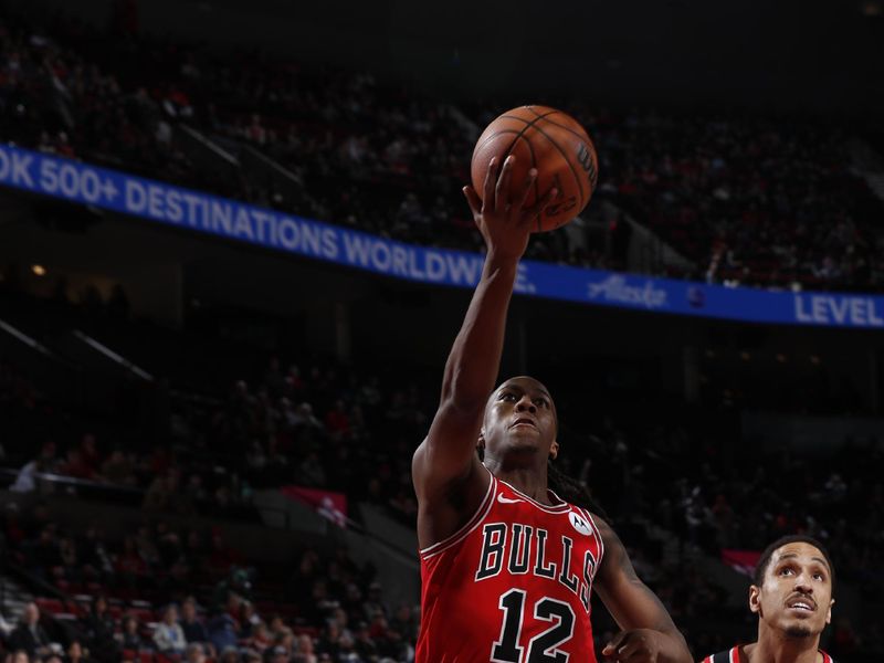 PORTLAND, OR - JANUARY 28: Ayo Dosunmu #12 of the Chicago Bulls shoots the ball during the game against the Portland Trail Blazers on January 28, 2024 at the Moda Center Arena in Portland, Oregon. NOTE TO USER: User expressly acknowledges and agrees that, by downloading and or using this photograph, user is consenting to the terms and conditions of the Getty Images License Agreement. Mandatory Copyright Notice: Copyright 2024 NBAE (Photo by Cameron Browne/NBAE via Getty Images)