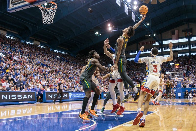 Feb 18, 2023; Lawrence, Kansas, USA; Baylor Bears forward Jalen Bridges (11) grabs a rebound during the first half against the Kansas Jayhawks at Allen Fieldhouse. Mandatory Credit: William Purnell-USA TODAY Sports