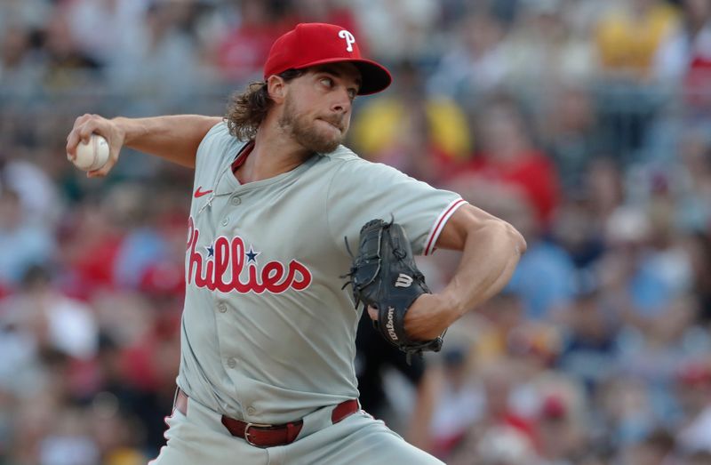 Jul 19, 2024; Pittsburgh, Pennsylvania, USA;  Philadelphia Phillies starting pitcher Aaron Nola (27) delivers a pitch against the Pittsburgh Pirates during the first inning at PNC Park. Mandatory Credit: Charles LeClaire-USA TODAY Sports