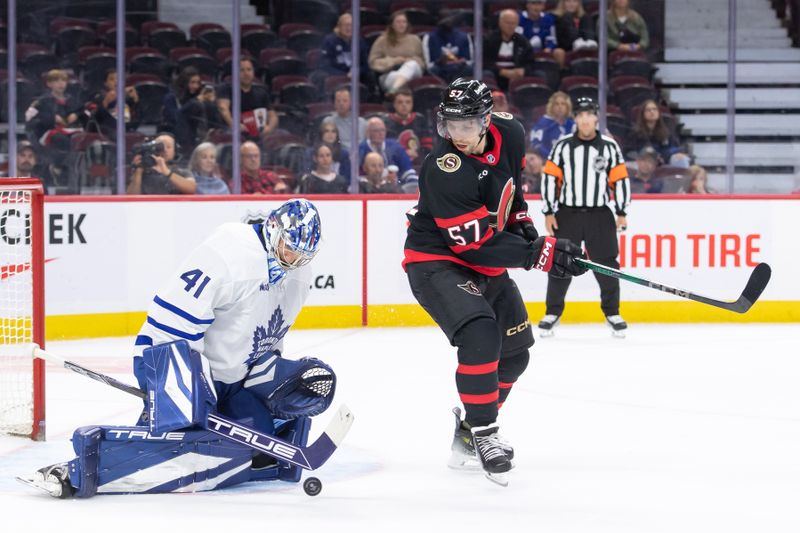 Sep 24, 2024; Ottawa, Ontario, CAN; Toronto Maple Leafs goalie Anthony Stolarz (41) makes a save in front of  Ottawa Senators left wing David Perron (57) in the first period at the Canadian Tire Centre. Mandatory Credit: Marc DesRosiers-Imagn Images