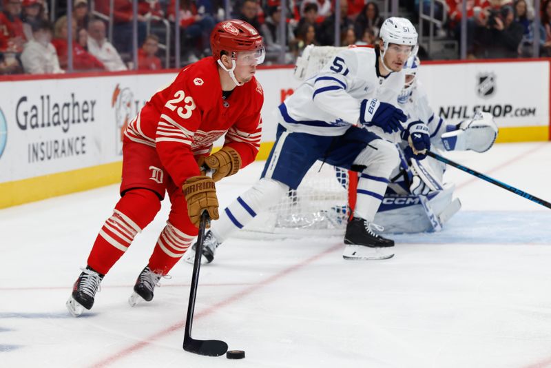 Dec 28, 2025; Detroit, Michigan, USA;  Detroit Red Wings left wing Lucas Raymond (23) skates with the puck in the second period against the Toronto Maple Leafs at Little Caesars Arena. Mandatory Credit: Rick Osentoski-Imagn Images