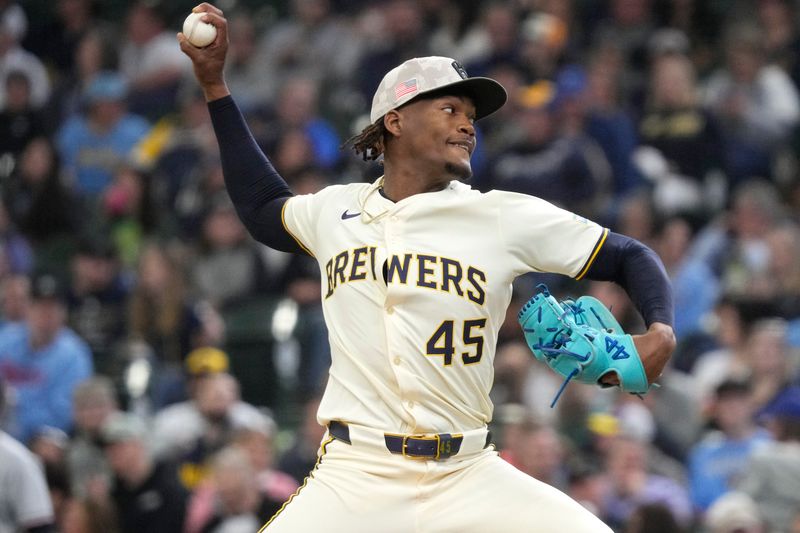 May 18, 2025; Milwaukee, Wisconsin, USA; Milwaukee Brewers pitcher Abner Uribe (45) delivers a pitch against the Minnesota Twins in the fifth inning at American Family Field. Mandatory Credit: Michael McLoone-Imagn Images