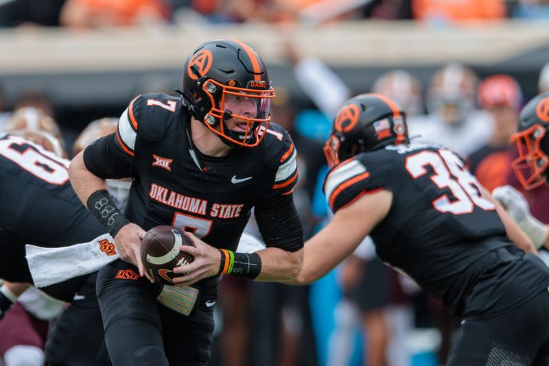 Nov 2, 2024; Stillwater, Oklahoma, USA; Oklahoma State Cowboys quarterback Alan Bowman (7) behind the line during the first quarter against the Arizona State Sun Devils at Boone Pickens Stadium. Mandatory Credit: William Purnell-Imagn Images