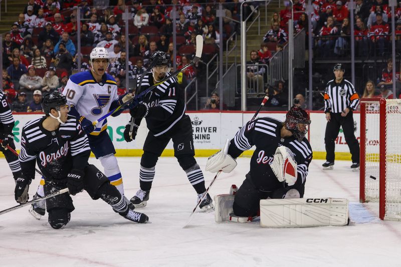 Nov 27, 2024; Newark, New Jersey, USA; St. Louis Blues center Dylan Holloway (81) (not shown) scores a goal on New Jersey Devils goaltender Jacob Markstrom (25) during the first period at Prudential Center. Mandatory Credit: Ed Mulholland-Imagn Images