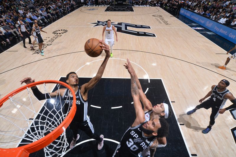 SAN ANTONIO, TX - APRIL 12:  Victor Wembanyama #1 of the San Antonio Spurs grabs the rebound during the game on April 12, 2024 at the Frost Bank Center in San Antonio, Texas. NOTE TO USER: User expressly acknowledges and agrees that, by downloading and or using this photograph, user is consenting to the terms and conditions of the Getty Images License Agreement. Mandatory Copyright Notice: Copyright 2024 NBAE (Photos by Michael Gonzales/NBAE via Getty Images)