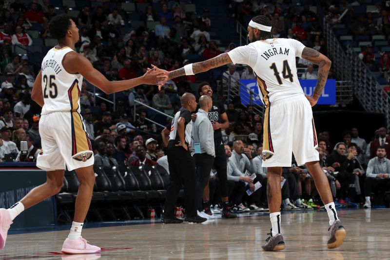NEW ORLEANS, LA - NOVEMBER 11: Trey Murphy III #25 and Brandon Ingram #14 of the New Orleans Pelicans high five during the game against the Brooklyn Nets on November 11, 2024 at the Smoothie King Center in New Orleans, Louisiana. NOTE TO USER: User expressly acknowledges and agrees that, by downloading and or using this Photograph, user is consenting to the terms and conditions of the Getty Images License Agreement. Mandatory Copyright Notice: Copyright 2024 NBAE (Photo by Layne Murdoch Jr./NBAE via Getty Images)