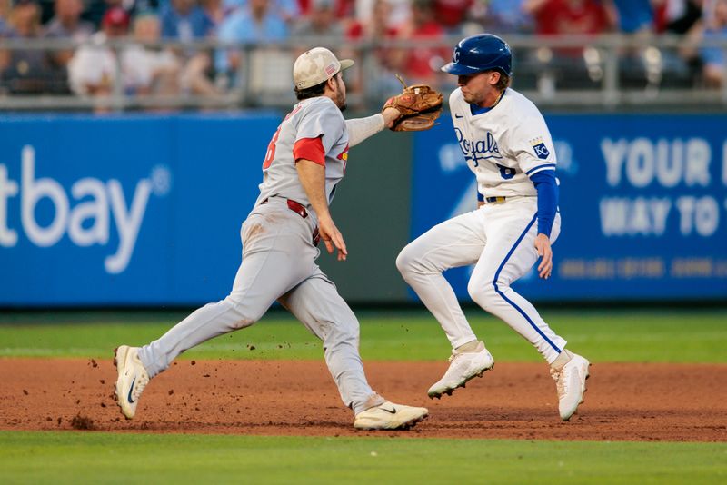May 17, 2025; Kansas City, Missouri, USA; St. Louis Cardinals third base Nolan Arenado (28) tags Kansas City Royals outfielder Drew Waters (8) during the eighth inning at Kauffman Stadium. Mandatory Credit: William Purnell-Imagn Images