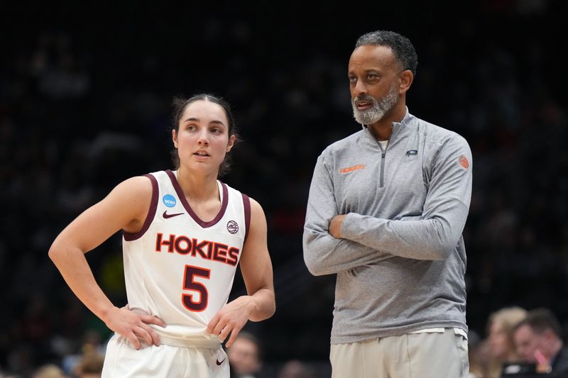 Mar 27, 2023; Seattle, WA, USA; Virginia Tech Hokies guard Georgia Amoore (5) talks with head coach Kenny Brooks during the second quarter at Climate Pledge Arena. Mandatory Credit: Kirby Lee-USA TODAY Sports 