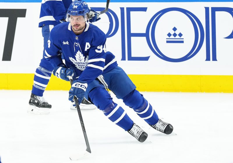 Mar 26, 2024; Toronto, Ontario, CAN; Toronto Maple Leafs center Auston Matthews (34) skates during the warmup before a game against the New Jersey Devils at Scotiabank Arena. Mandatory Credit: Nick Turchiaro-USA TODAY Sports