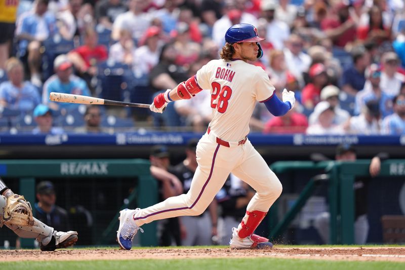 Apr 19, 2025; Philadelphia, Pennsylvania, USA; Philadelphia Phillies infielder Alec Bohm (28) hits a single against the Miami Marlins in the fourth inning at Citizens Bank Park. Mandatory Credit: Kyle Ross-Imagn Images