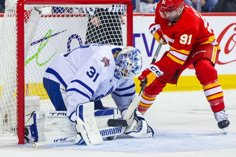 Jan 18, 2024; Calgary, Alberta, CAN; Toronto Maple Leafs goaltender Martin Jones (31) makes a save against Calgary Flames center Nazem Kadri (91) during the second period at Scotiabank Saddledome. Mandatory Credit: Sergei Belski-USA TODAY Sports