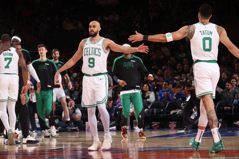 NEW YORK, NY - APRIL 8:  Derrick White #9 high fives Jayson Tatum #0 of the Boston Celtics during the game against the New York Knicks on April 8, 2025 at Madison Square Garden in New York City, New York.  NOTE TO USER: User expressly acknowledges and agrees that, by downloading and or using this photograph, User is consenting to the terms and conditions of the Getty Images License Agreement. Mandatory Copyright Notice: Copyright 2025 NBAE  (Photo by Nathaniel S. Butler/NBAE via Getty Images)