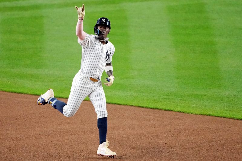 Oct 30, 2024; New York, New York, USA; New York Yankees third baseman Jazz Chisholm Jr. (13) celebrates after hitting a solo home run during the first inning against the Los Angeles Dodgers in game four of the 2024 MLB World Series at Yankee Stadium. Mandatory Credit: Robert Deutsch-Imagn Images