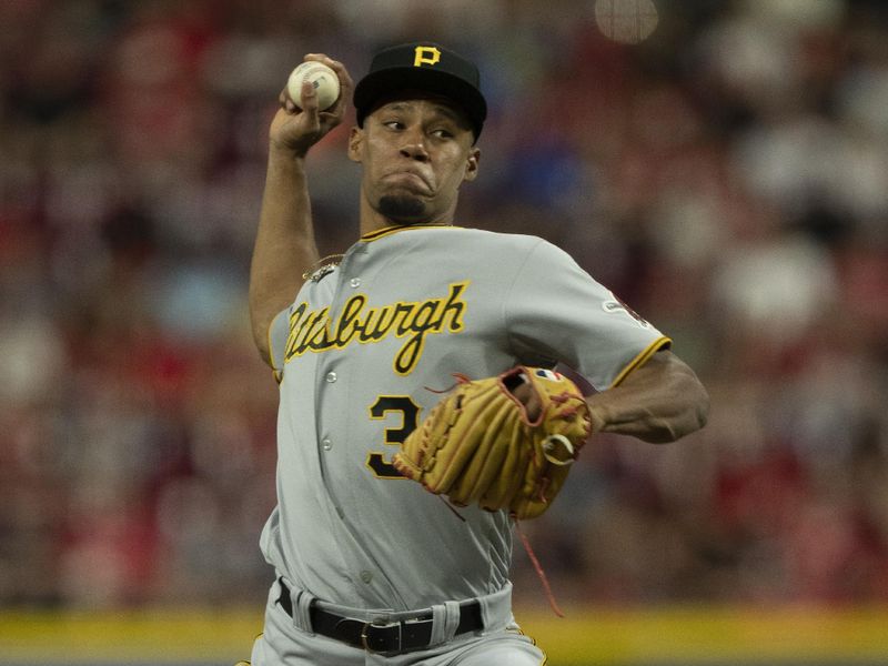 Sep 23, 2023; Cincinnati, Ohio, USA; Pittsburgh Pirates relief pitcher Dauri Moreta (36) pitches in the fifth inning against the Cincinnati Reds at Great American Ball Park. Mandatory Credit: The Cincinnati Enquirer-USA TODAY Sports