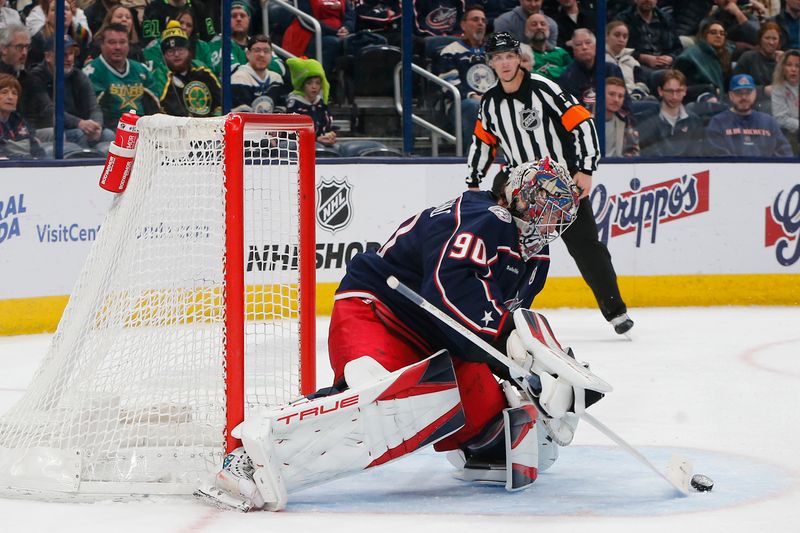 Feb 25, 2025; Columbus, Ohio, USA; Columbus Blue Jackets goalie Elvis Merzlikins (90) makes a save against the Dallas Stars during the third period at Nationwide Arena. Mandatory Credit: Russell LaBounty-Imagn Images