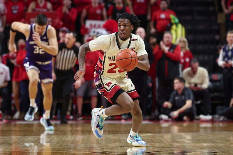 Feb 15, 2024; Piscataway, New Jersey, USA; Rutgers Scarlet Knights guard Jeremiah Williams (25) dribbles up court in front of Northwestern Wildcats forward Blake Preston (32) during the second half at Jersey Mike's Arena. Mandatory Credit: Vincent Carchietta-USA TODAY Sports