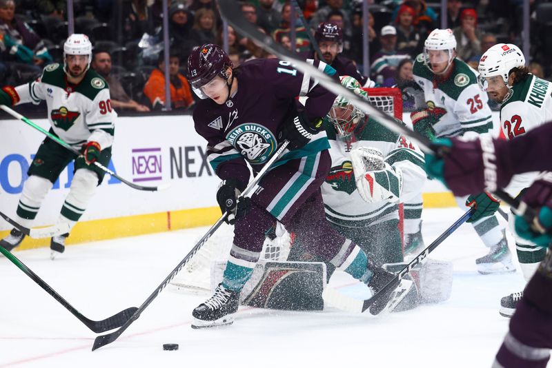 Mar 19, 2024; Anaheim, California, USA; Minnesota Wild goaltender Filip Gustavsson (32) makes a save against Anaheim Ducks right wing Troy Terry (19) during the second period of a game at Honda Center. Mandatory Credit: Jessica Alcheh-USA TODAY Sports