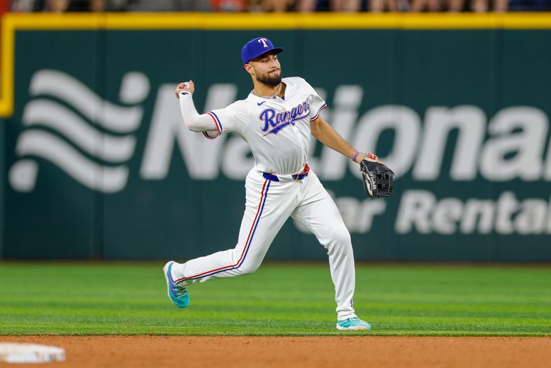 Jul 23, 2024; Arlington, Texas, USA; Texas Rangers third base Jonathan Ornelas (21) throws over to first during the sixth inning against the Chicago White Sox at Globe Life Field. Mandatory Credit: Andrew Dieb-USA TODAY Sports