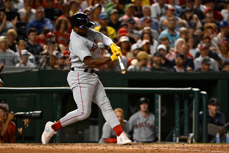 Aug 16, 2023; Washington, District of Columbia, USA; Boston Red Sox shortstop Pablo Reyes (19) hits a two run home run against the Washington Nationals during the eighth inning at Nationals Park. Mandatory Credit: Brad Mills-USA TODAY Sports