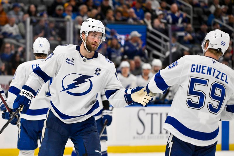 Nov 5, 2024; St. Louis, Missouri, USA;  Tampa Bay Lightning defenseman Victor Hedman (77) is congratulated by center Jake Guentzel (59) after scoring against the St. Louis Blues during the third period at Enterprise Center. Mandatory Credit: Jeff Curry-Imagn Images