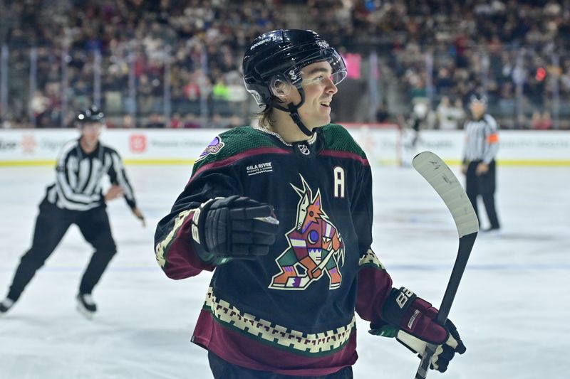 Nov 7, 2023; Tempe, Arizona, USA; Arizona Coyotes right wing Clayton Keller (9) celebrates after scoring a goal in the second period against the Seattle Kraken at Mullett Arena. Mandatory Credit: Matt Kartozian-USA TODAY Sports