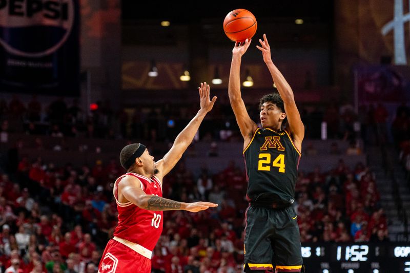 Feb 25, 2024; Lincoln, Nebraska, USA; Minnesota Golden Gophers guard Cam Christie (24) shoots a three-point shot against Nebraska Cornhuskers guard Jamarques Lawrence (10) during the second half at Pinnacle Bank Arena. Mandatory Credit: Dylan Widger-USA TODAY Sports