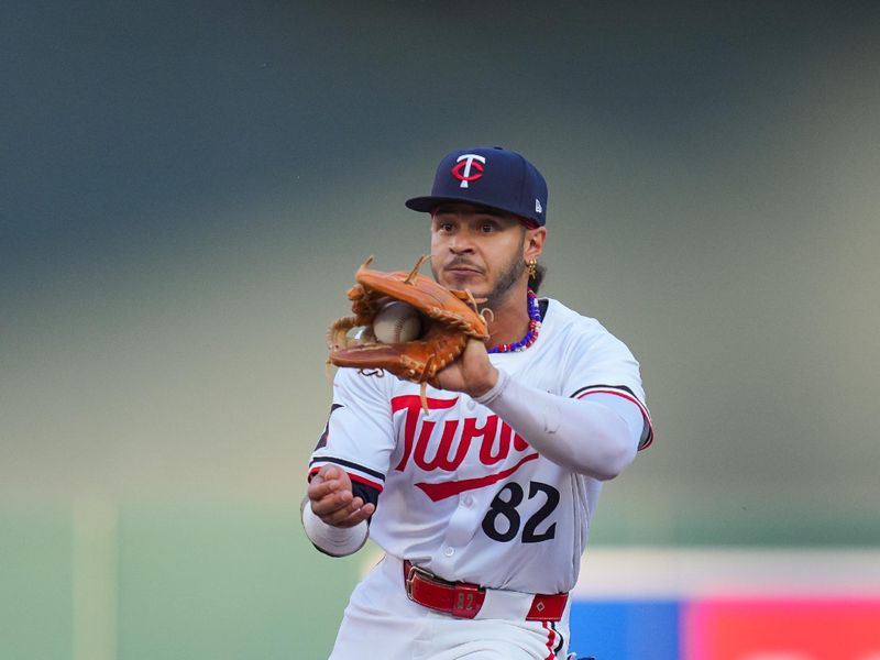 Aug 12, 2024; Minneapolis, Minnesota, USA; Minnesota Twins second base Austin Martin (82) catches the ball for the out against the Kansas City Royals in the second inning at Target Field. Mandatory Credit: Brad Rempel-USA TODAY Sports