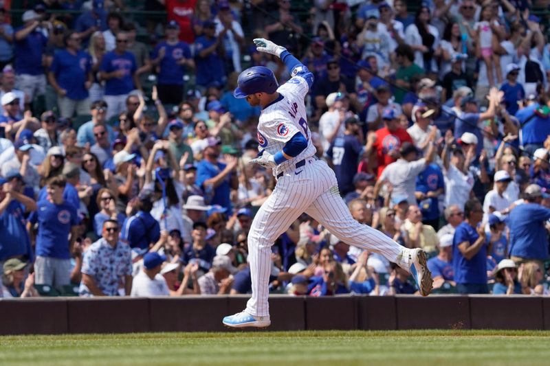 Aug 7, 2024; Chicago, Illinois, USA; Chicago Cubs outfielder Ian Happ (8) gestures after hitting a two-run home run against the Minnesota Twins during the fourth inning at Wrigley Field. Mandatory Credit: David Banks-USA TODAY Sports