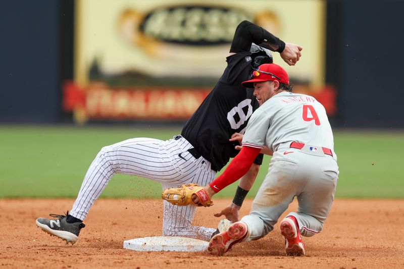 Mar 18, 2024; Tampa, Florida, USA;  New York Yankees catcher Austin Wells (88) is caught stealing by Philadelphia Phillies shortstop Scott Kingery (4) in the fourth inning at George M. Steinbrenner Field. Mandatory Credit: Nathan Ray Seebeck-USA TODAY Sports